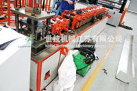 Wall panel roll forming machine