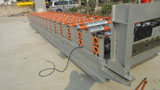 Roof panel roll forming machine